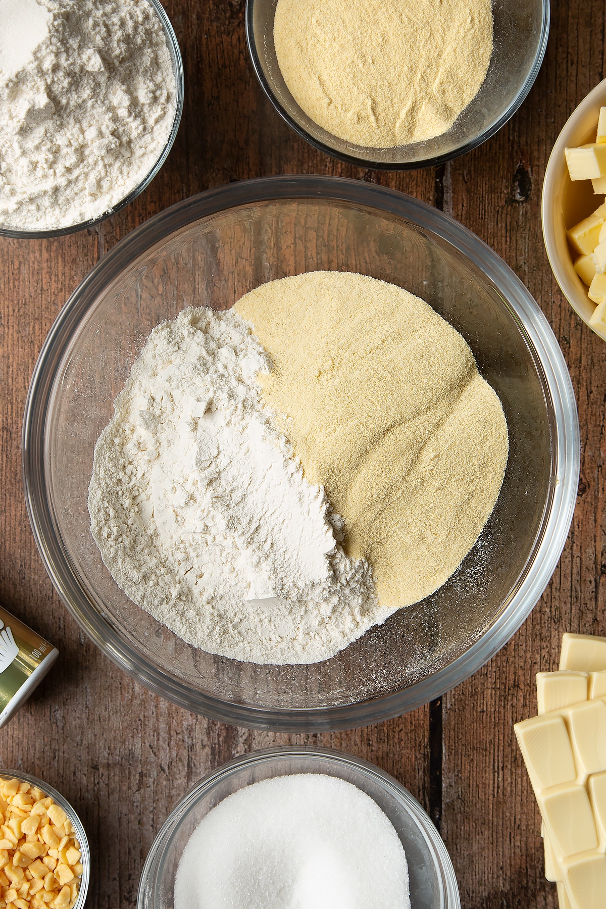 Overhead shot of sugar, flour and semolina in a large bowl