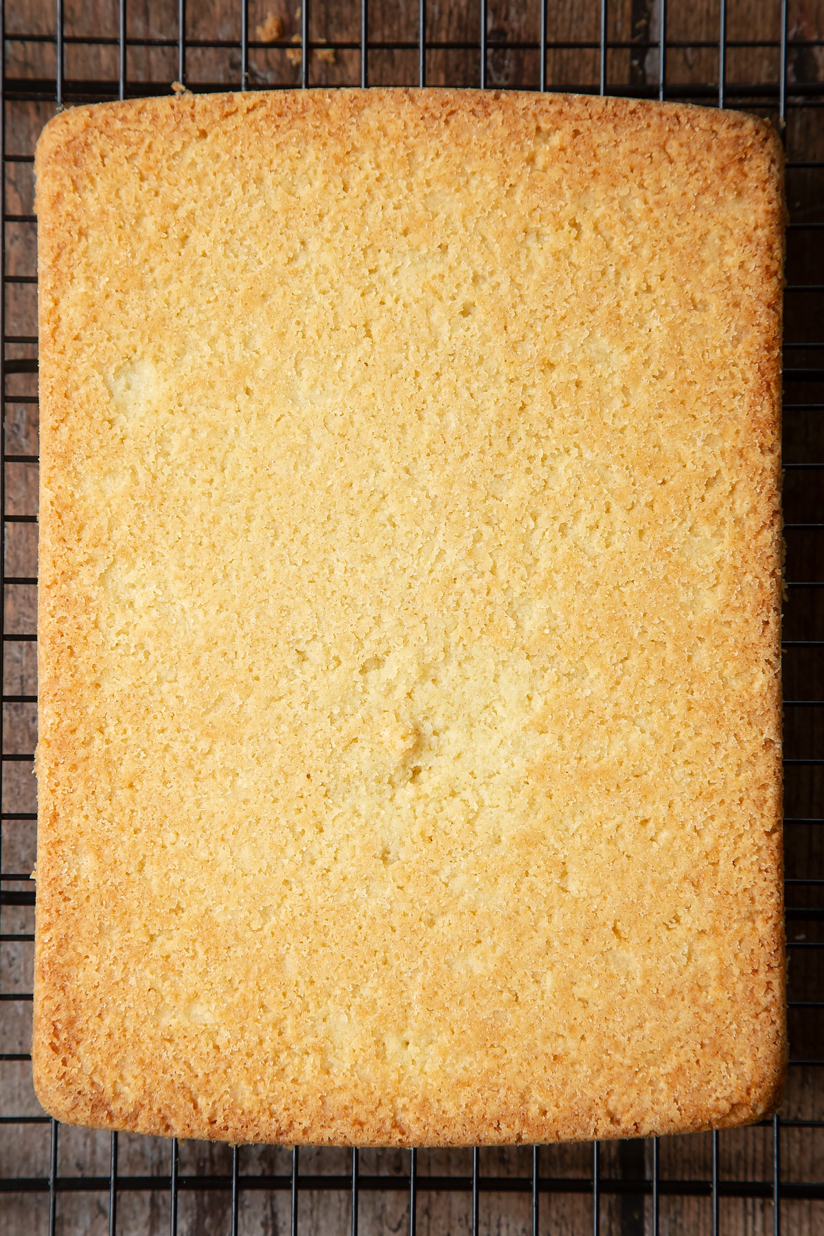 Overhead shot of the cake cooling on a wire rack.