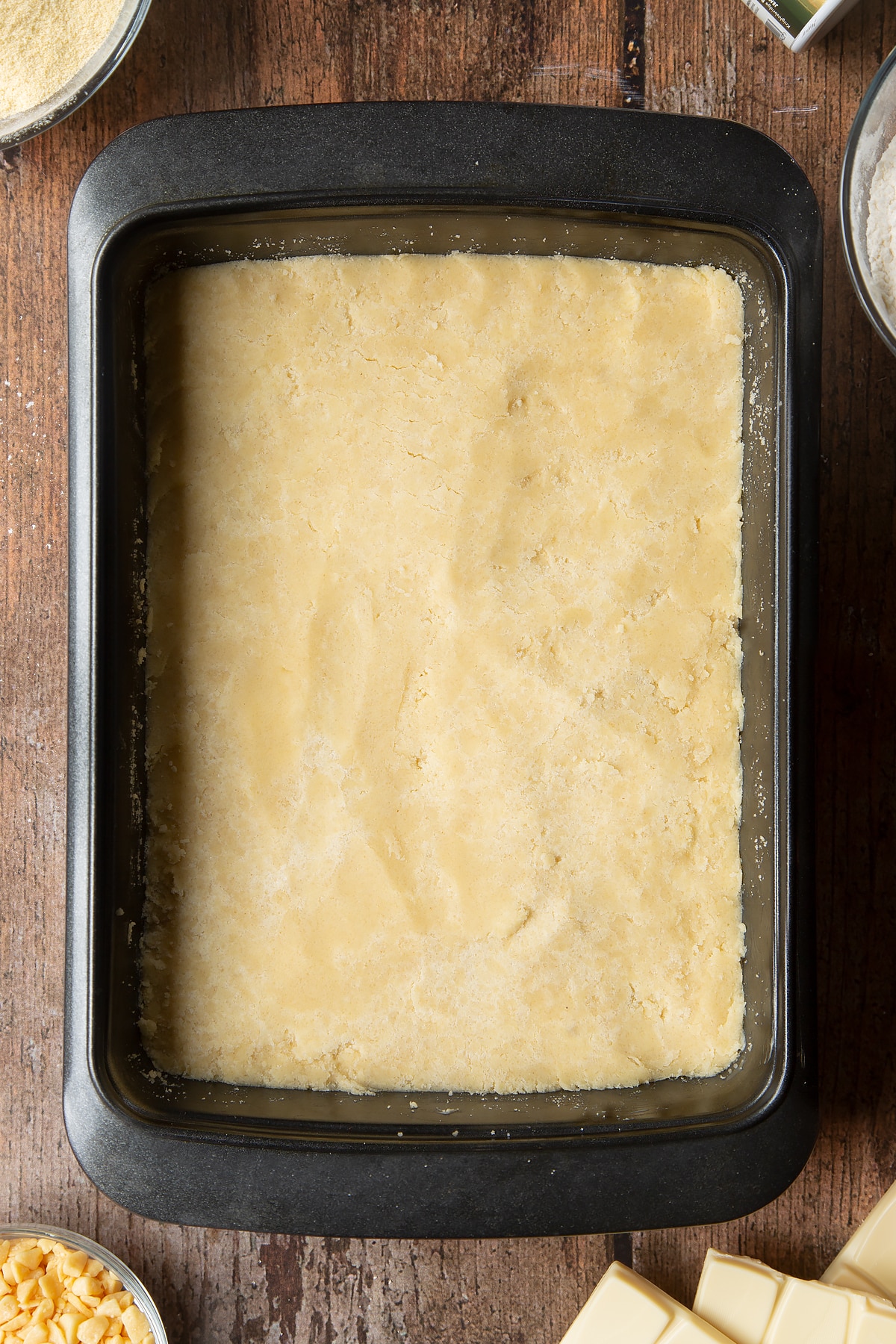 Overhead shot of dough in a medium roasting tin