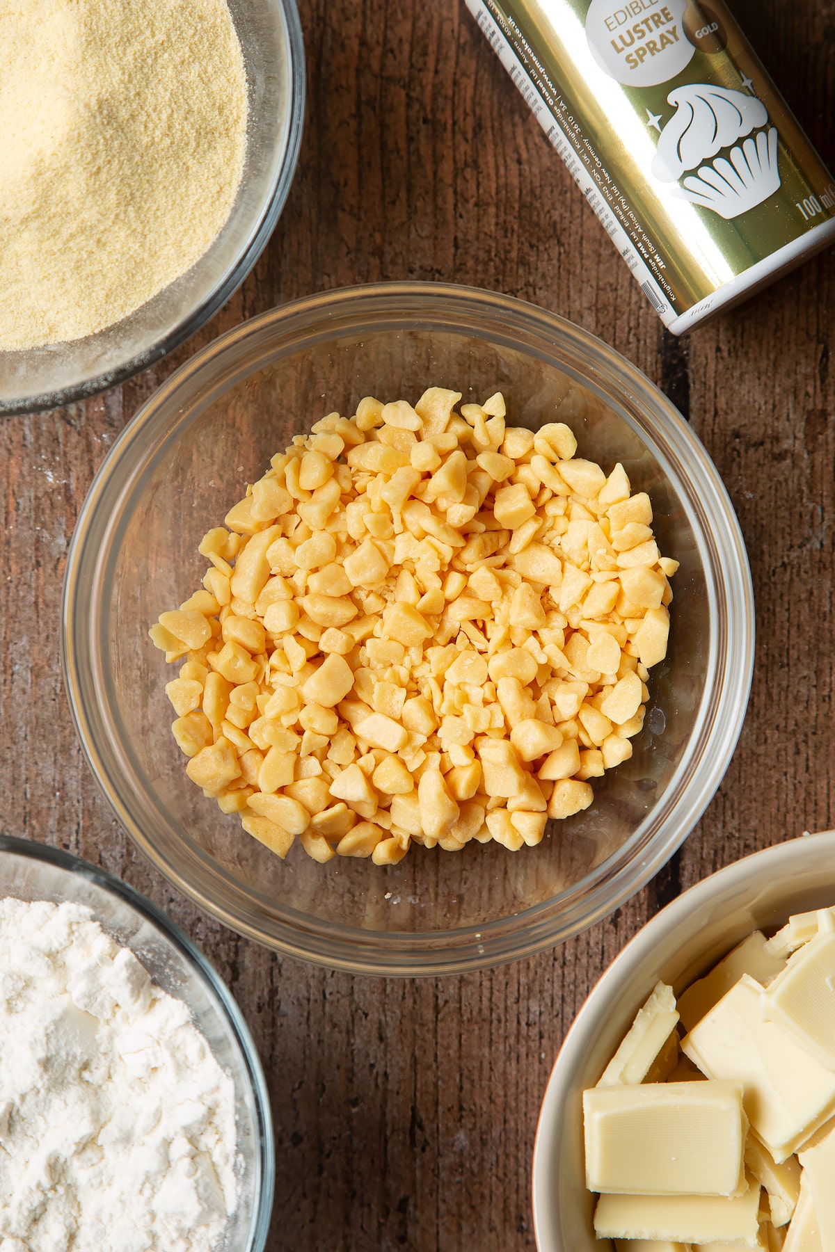 Overhead shot of honeycomb pieces in a clear bowl.