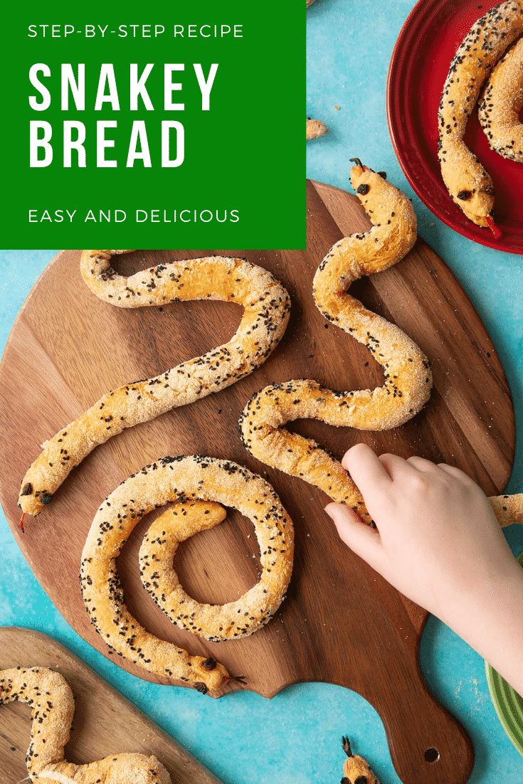 A hand holds a bread snake amongst more on a wooden board. Caption reads: step-by-step recipe snake breadsticks easy and delicious