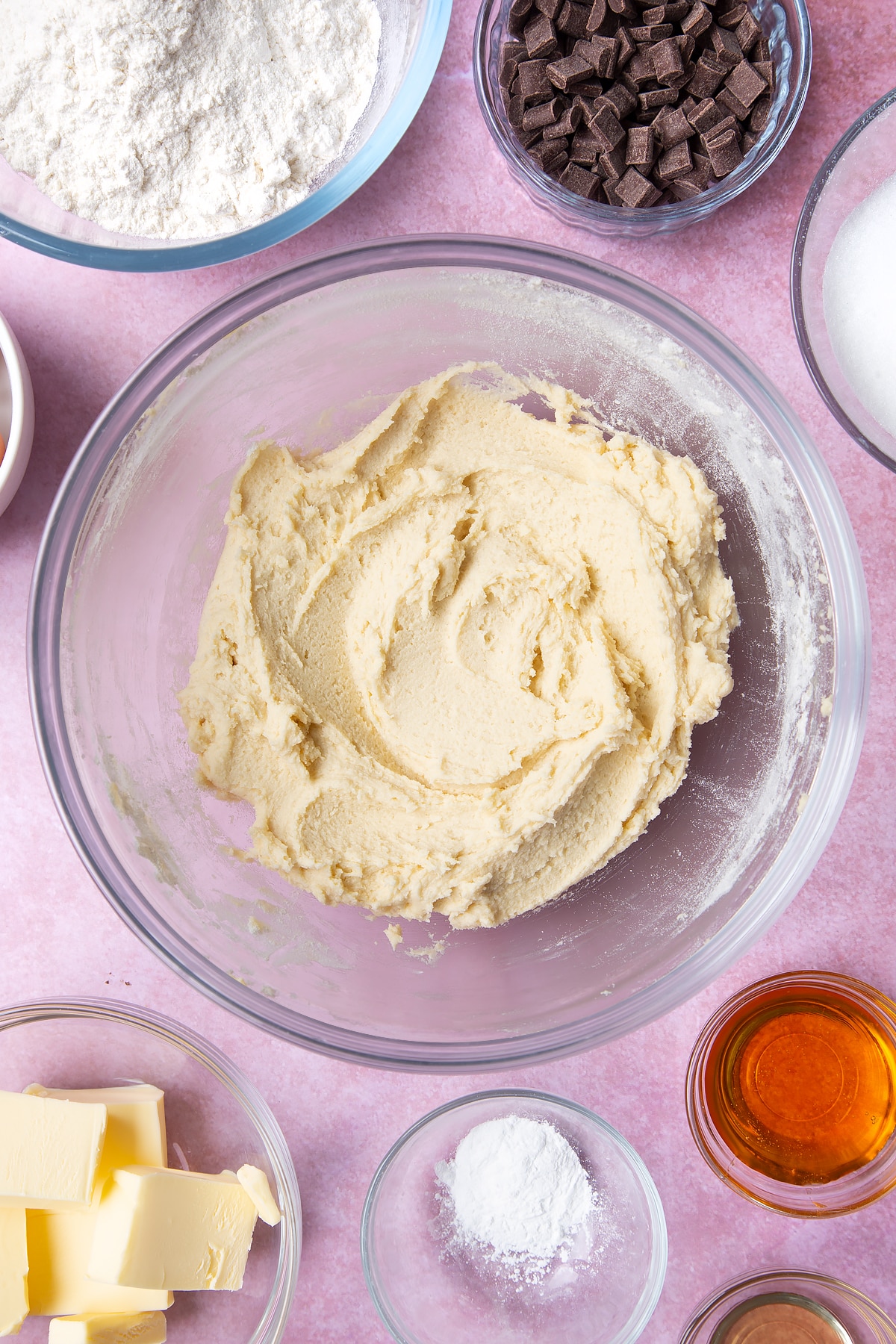 Overhead shot of cookie dough in a large clear bowl