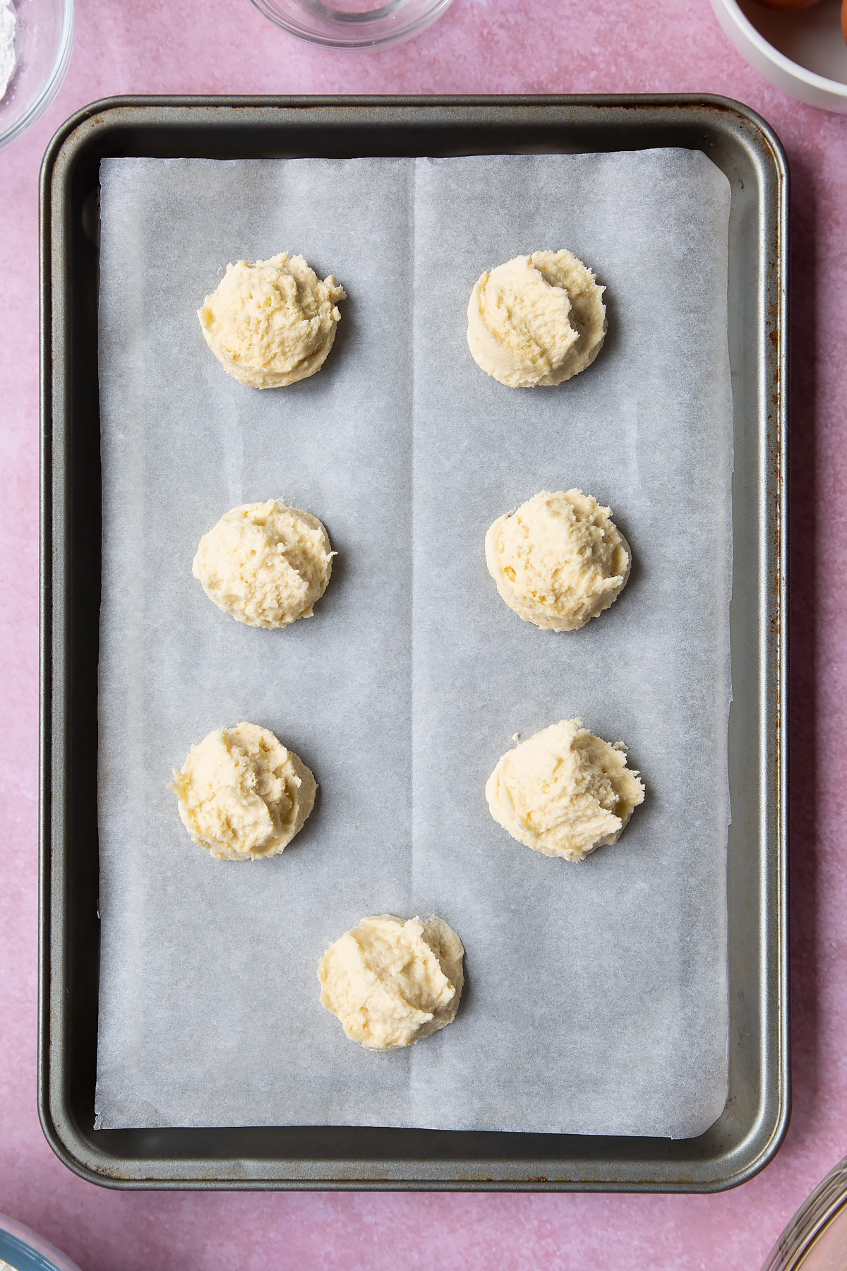 Overhead shot of cookie dough ball in a baking tray