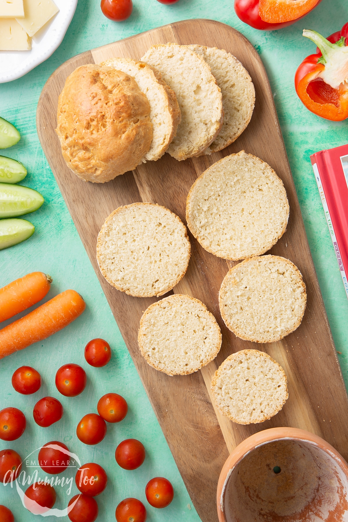 Overhead shot of the sliced flower pot bread on a wooden board.
