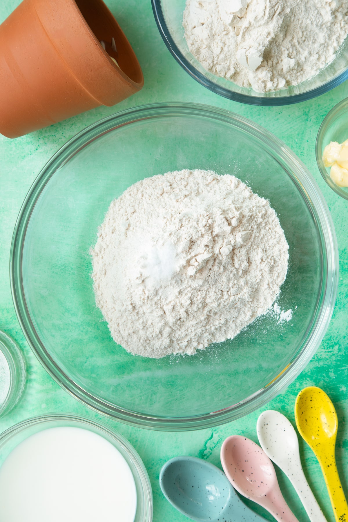 Overhead shot of flour and salt in a large bowl