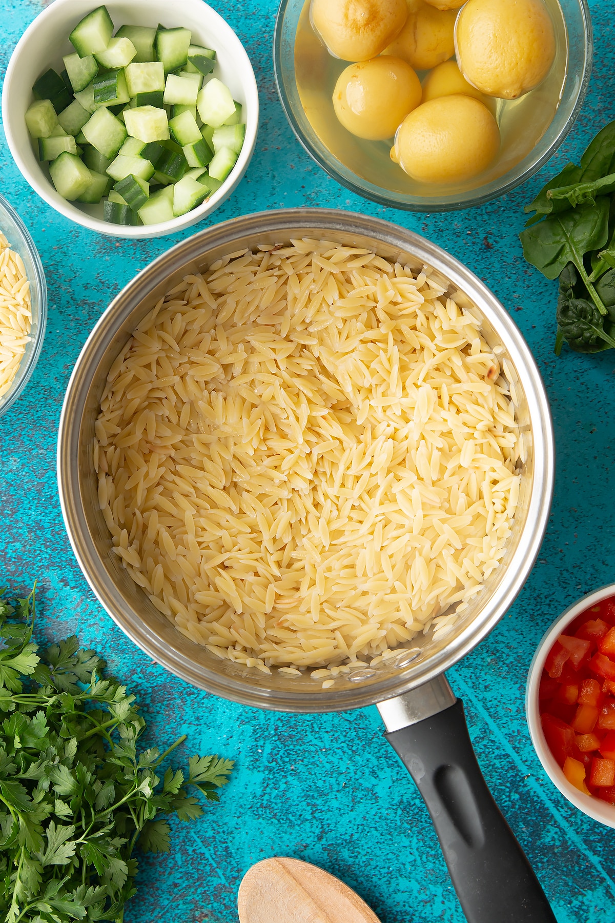 Cooked orzo in a saucepan.
