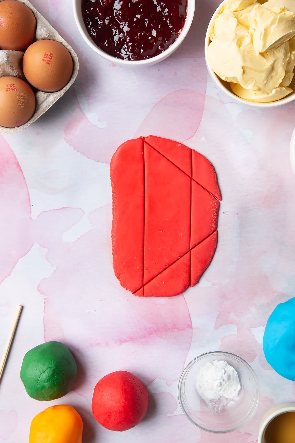 Overhead shot of cut out rolled out red sugar paste