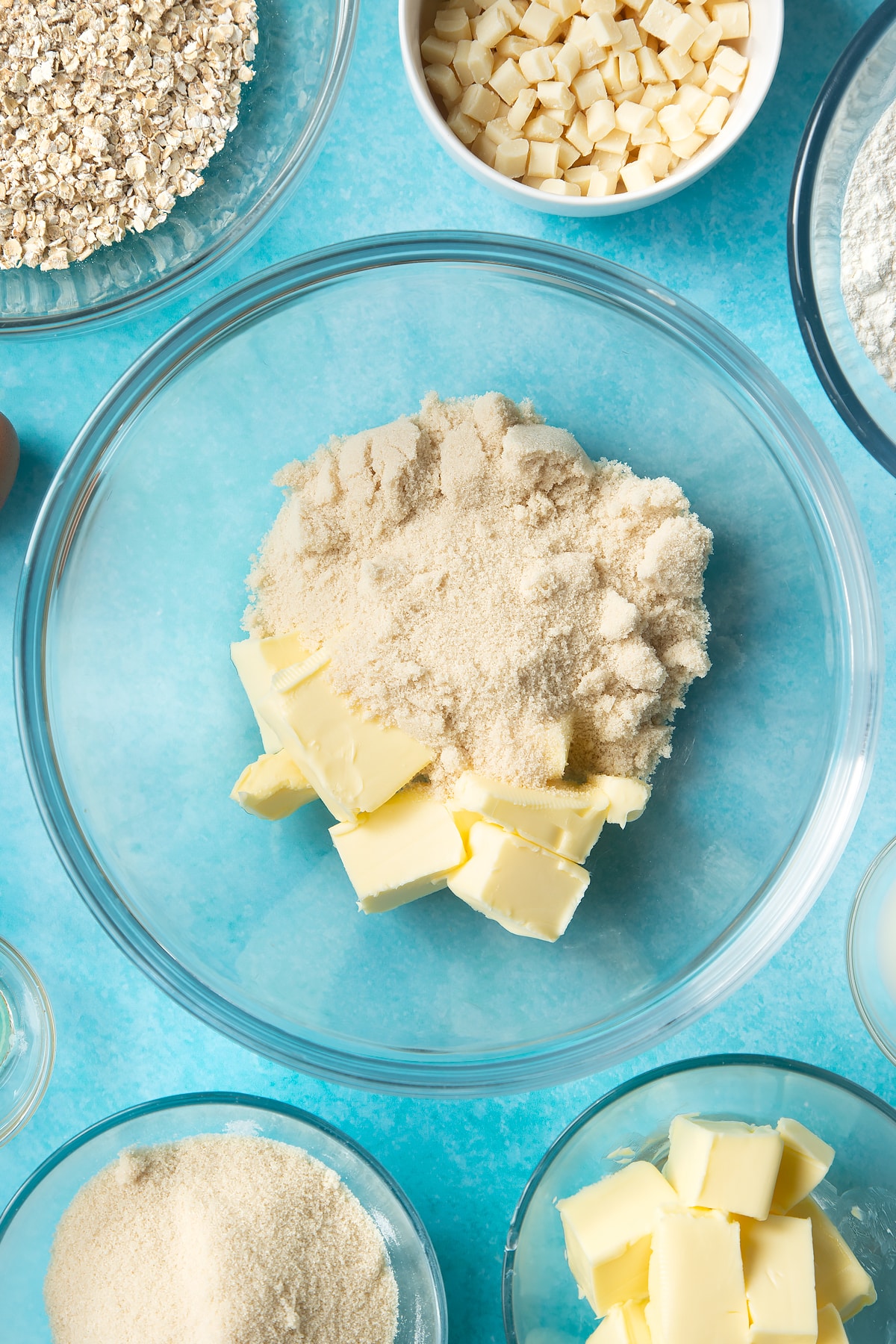 Overhead shot of softened butter and sugar in a bowl