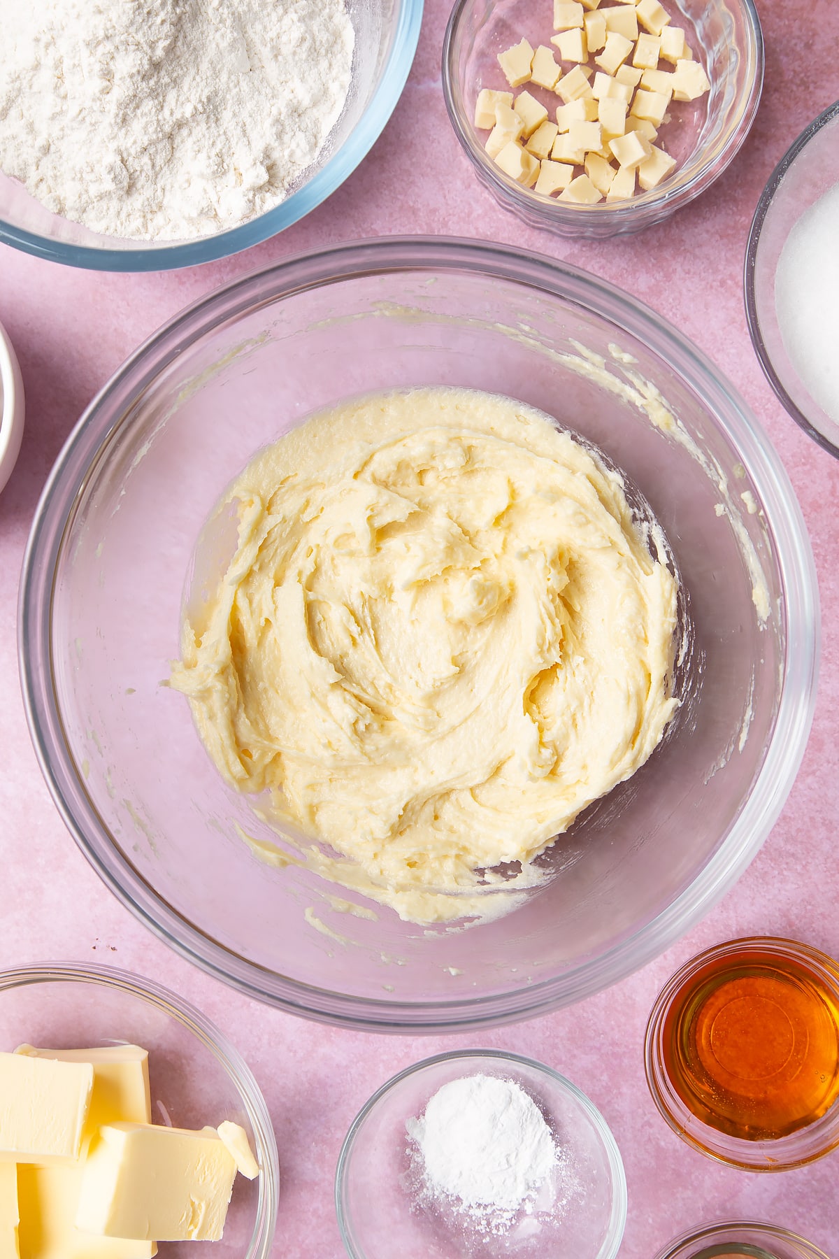 Overhead shot of butter mix and an egg in a large mixing bowl