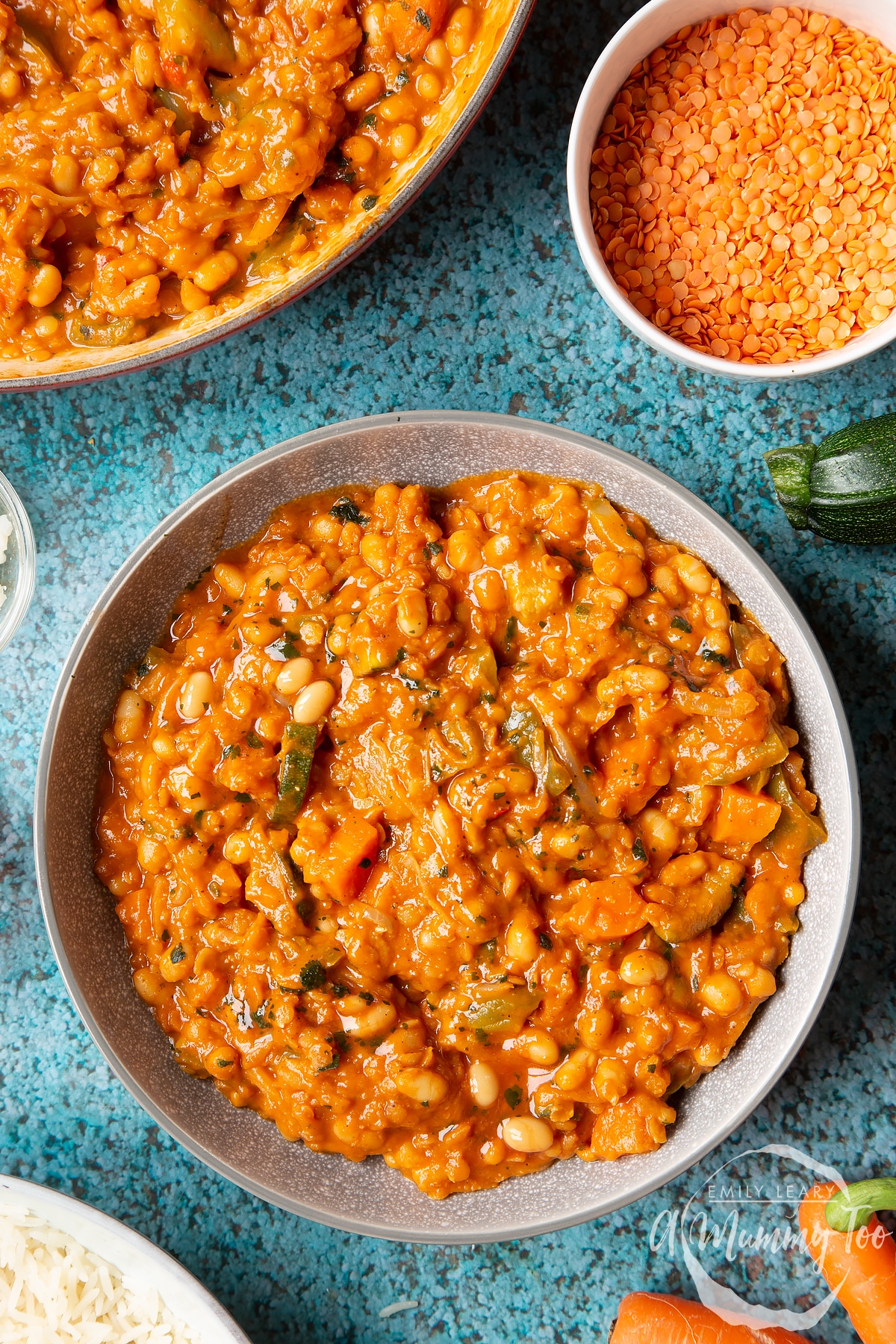 Baked bean curry served in a grey bowl.