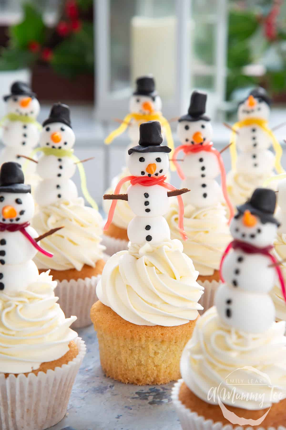 Multiple snowman cupcakes.