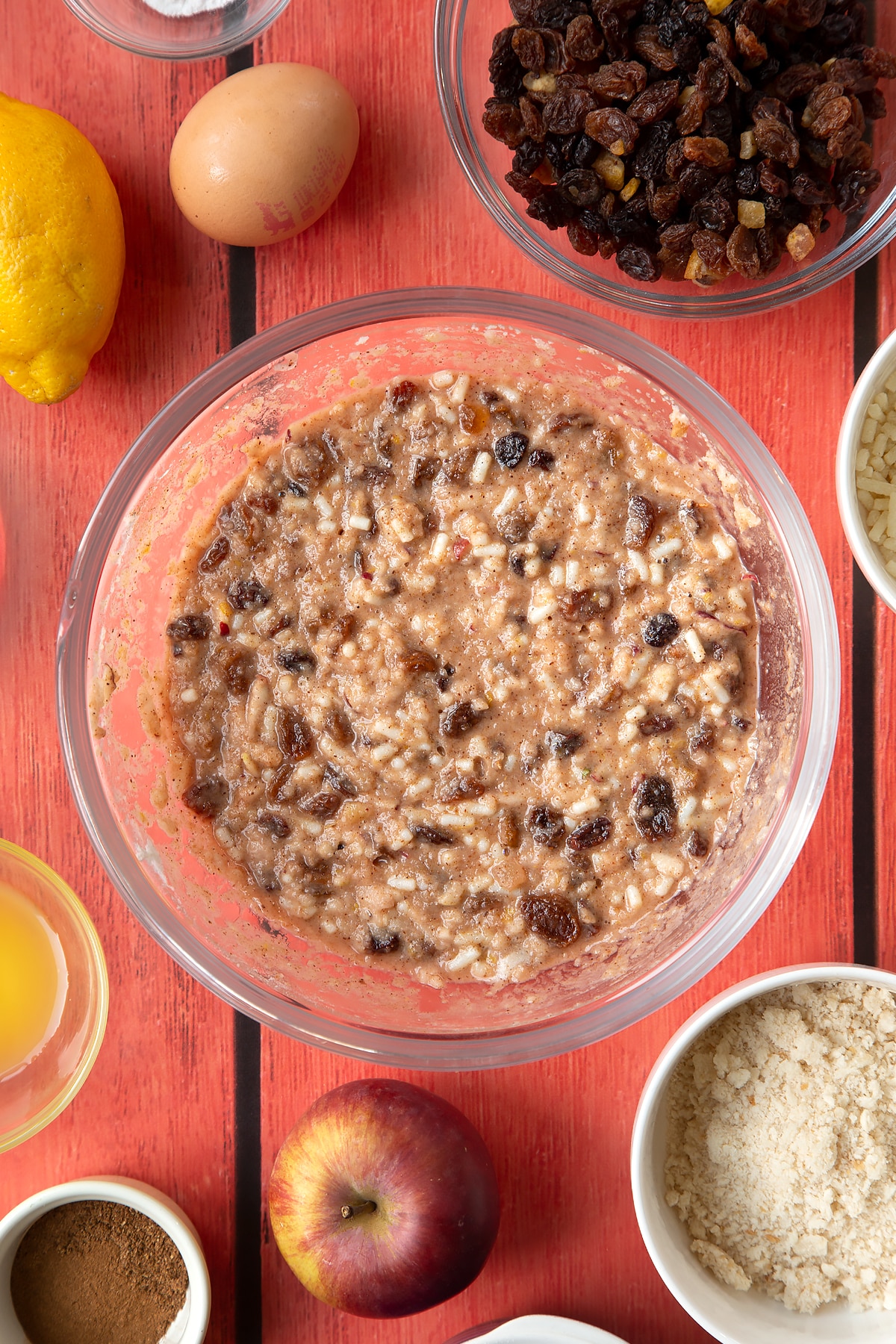 Overhead shot of alcohol free christmas pudding batter in a large clear bowl