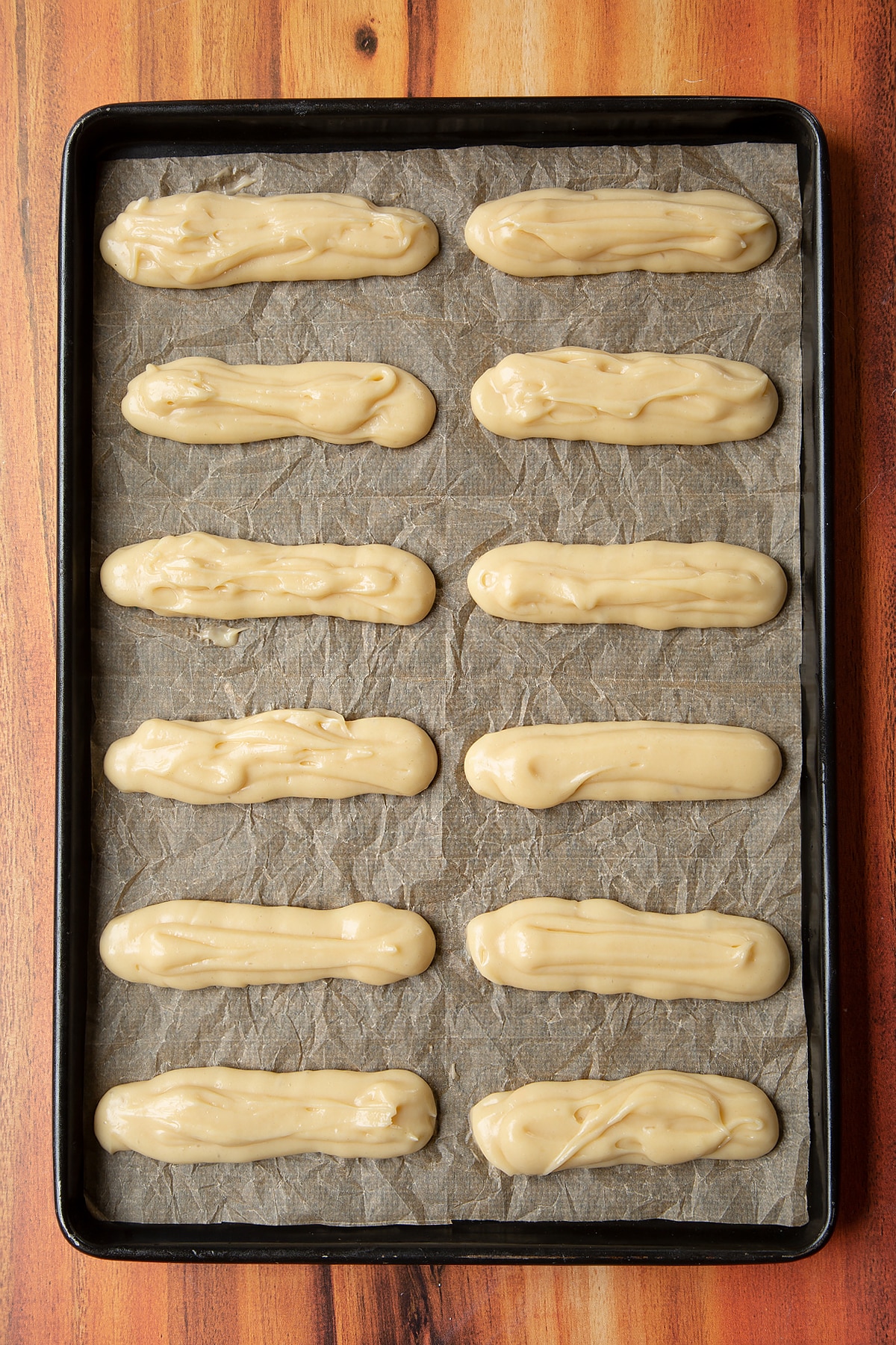 Overhead shot of choux base topped with cream served on a white plate