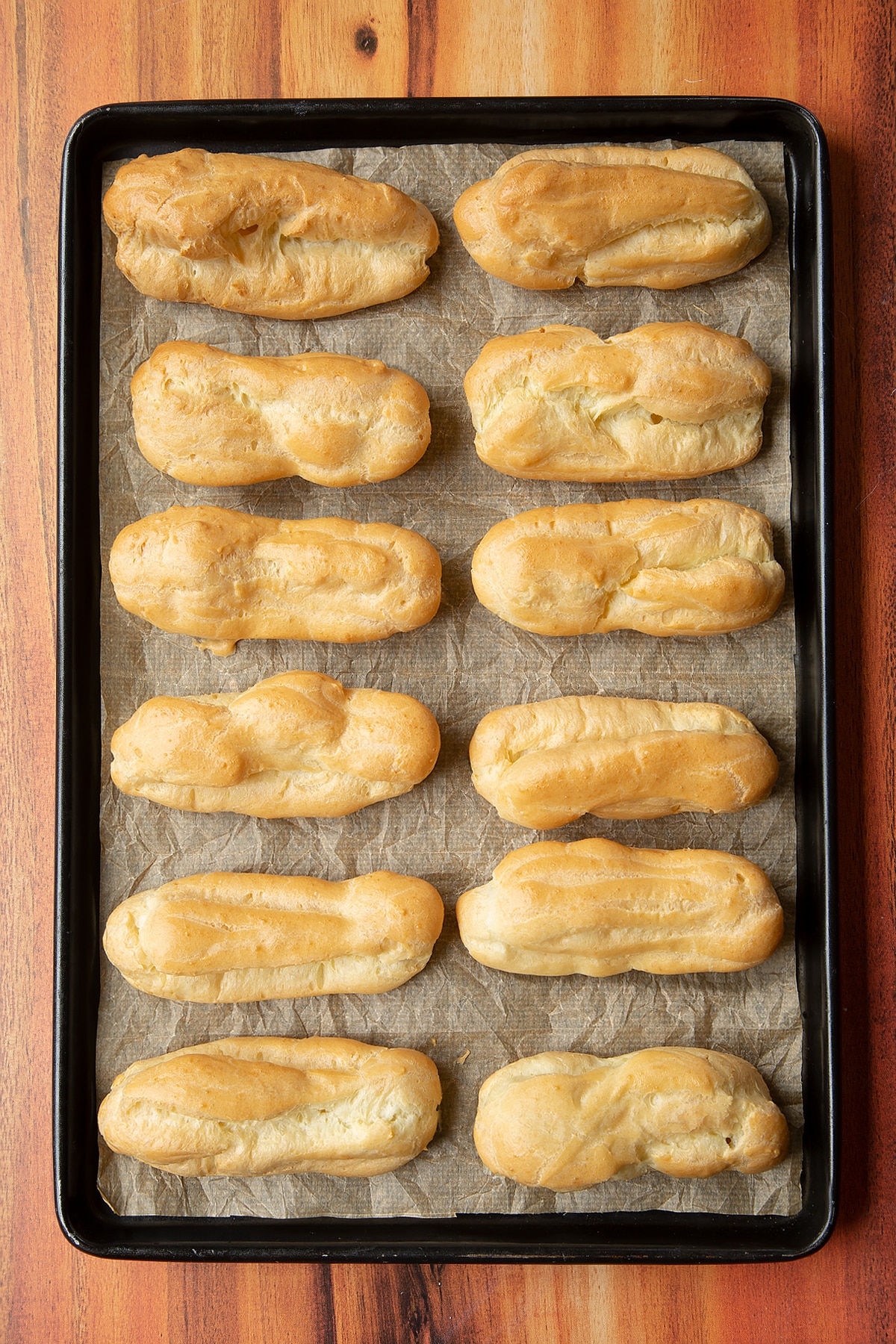 Overhead shot of a baked choux pastry on a baking tray.