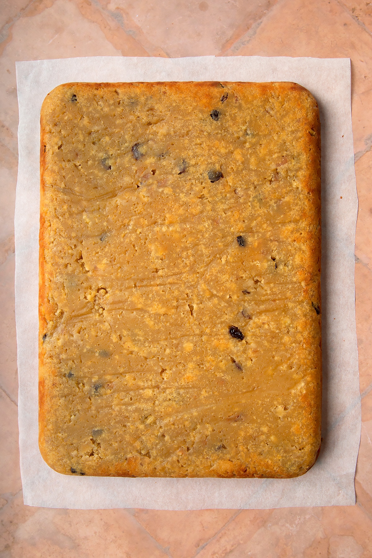 Sanwin makin cake turned out onto baking paper.