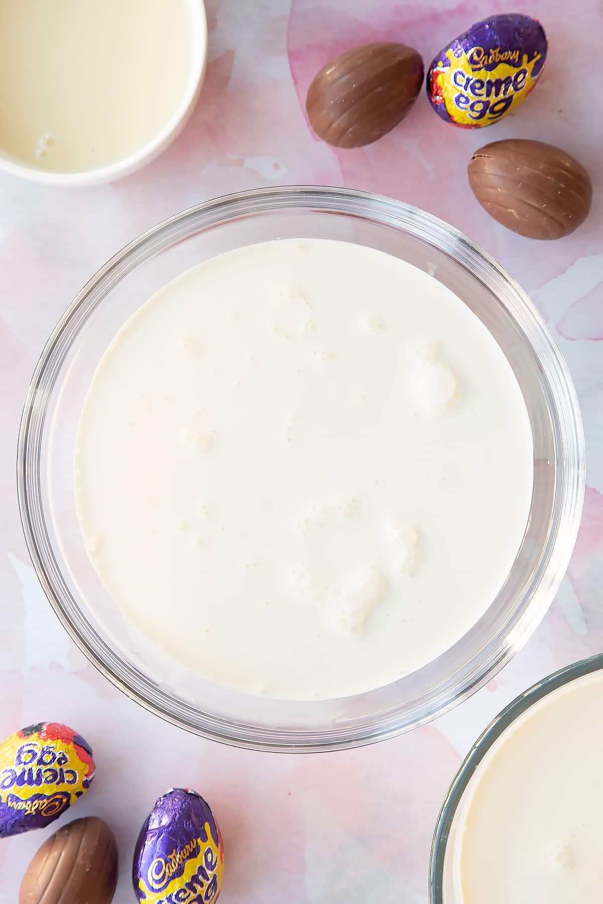 Whipping cream in a bowl.