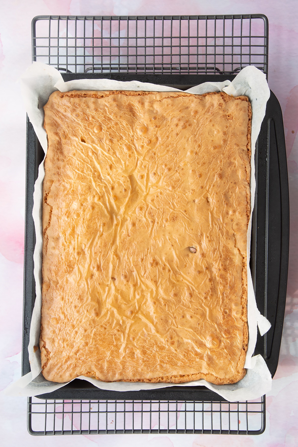 Mini Egg blondies baked in a lined tray.