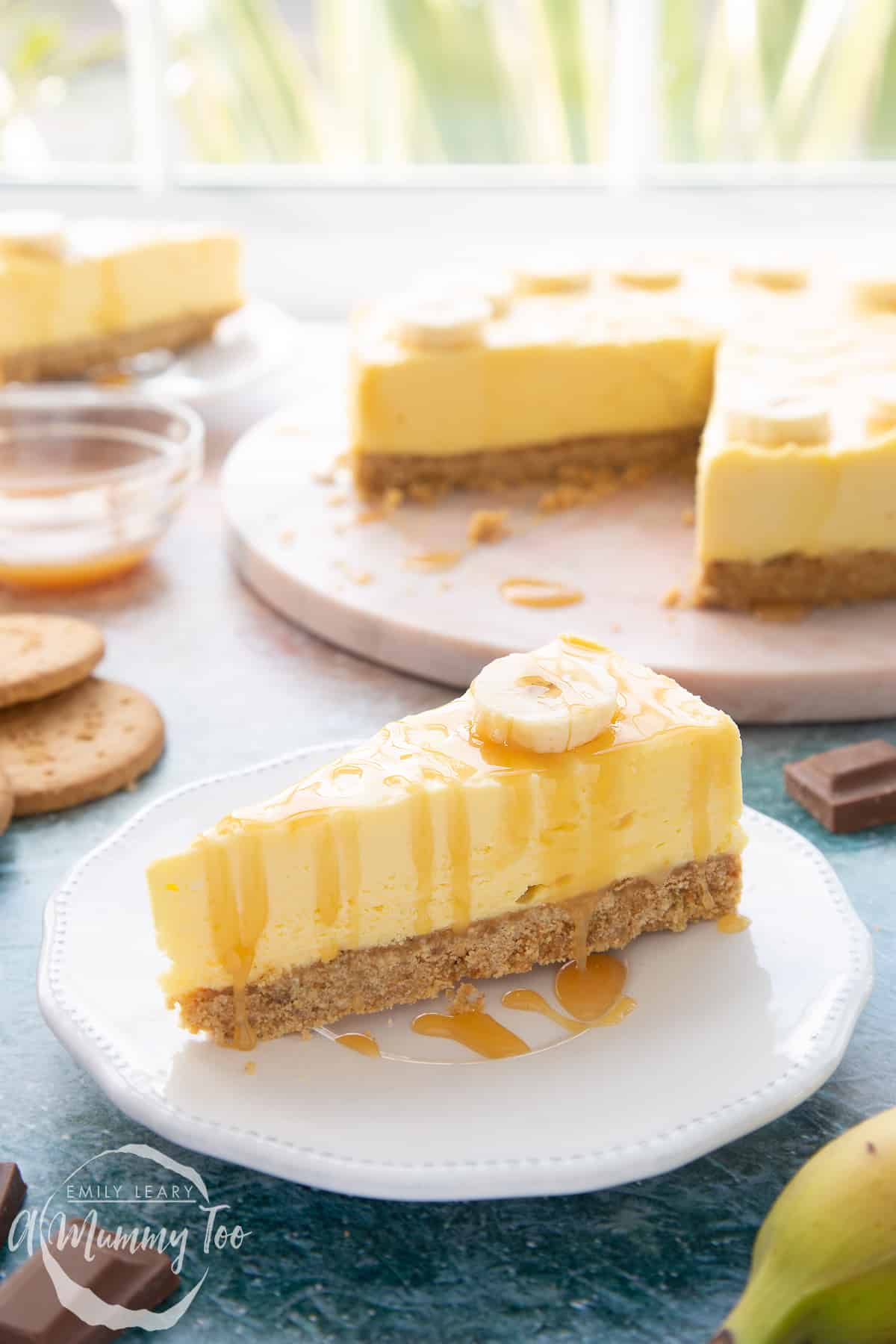 A slice of banoffee pie cheesecake on a white plate.
