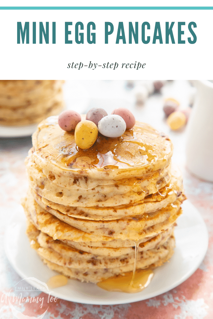 Tall, fluffy Mini Egg pancakes on a white plate in a tall stack. They are topped with syrup and Mini Eggs. Caption reads: Mini Egg pancakes step-by-step recipe