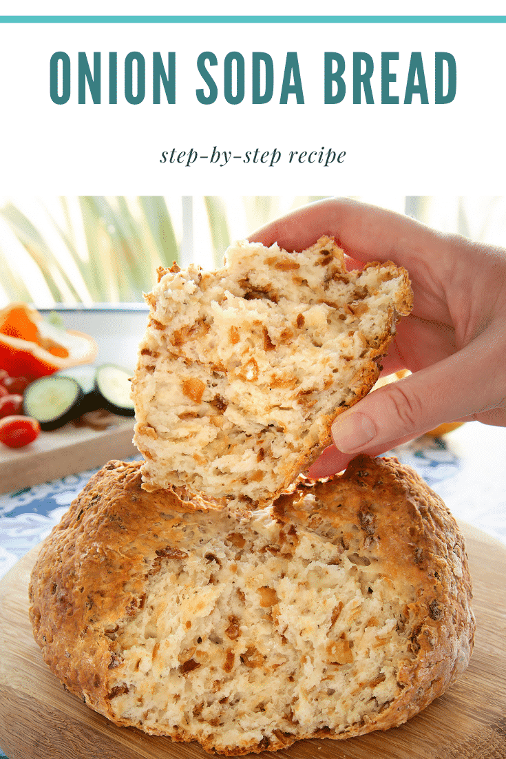 Onion soda bread on a wooden board. A hand holds a piece. Caption reads: onion soda bread step-by-step recipe.