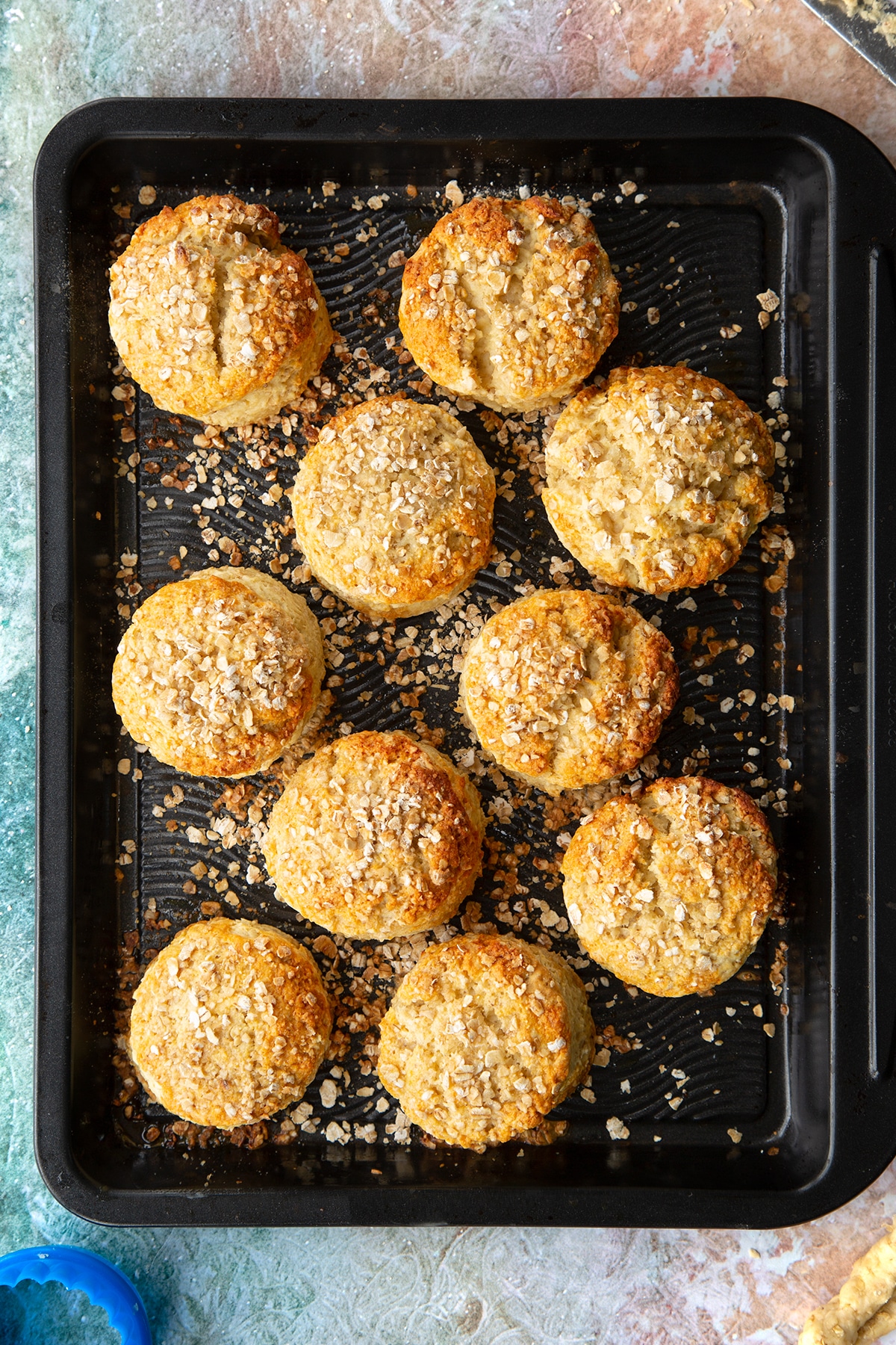 Freshly baked oatmeal scones on a baking tray.