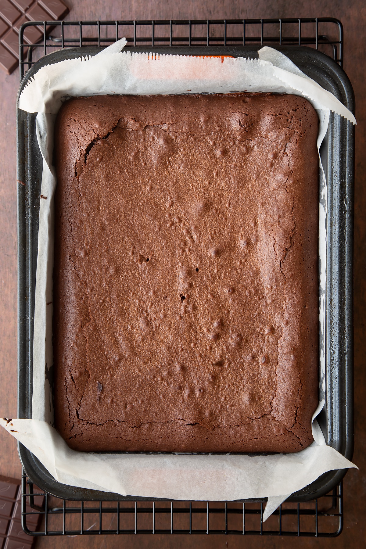 Freshly baked candy cane brownies in a lined tin.