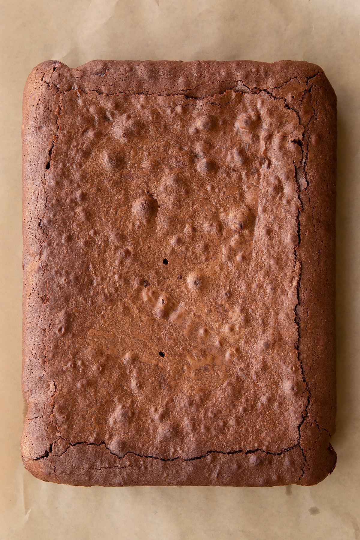 Baked candy cane brownie on baking paper.