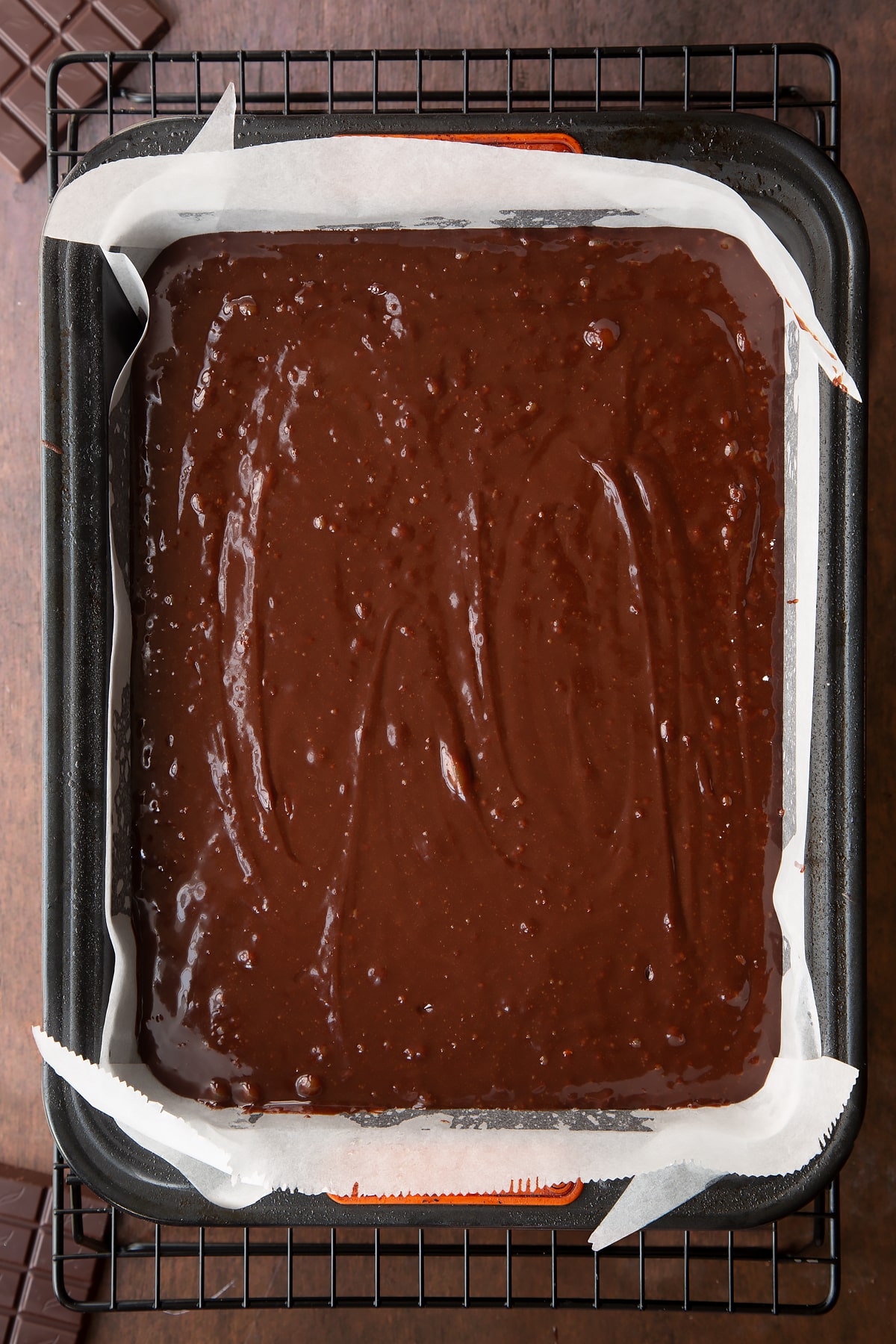 Halloween brownie batter in a greased and lined baking tin.