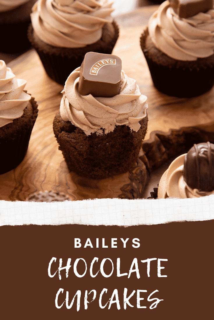 Baileys chocolate cupcake on a board with a bite out of it. Caption reads: Baileys chocolate cupcakes.