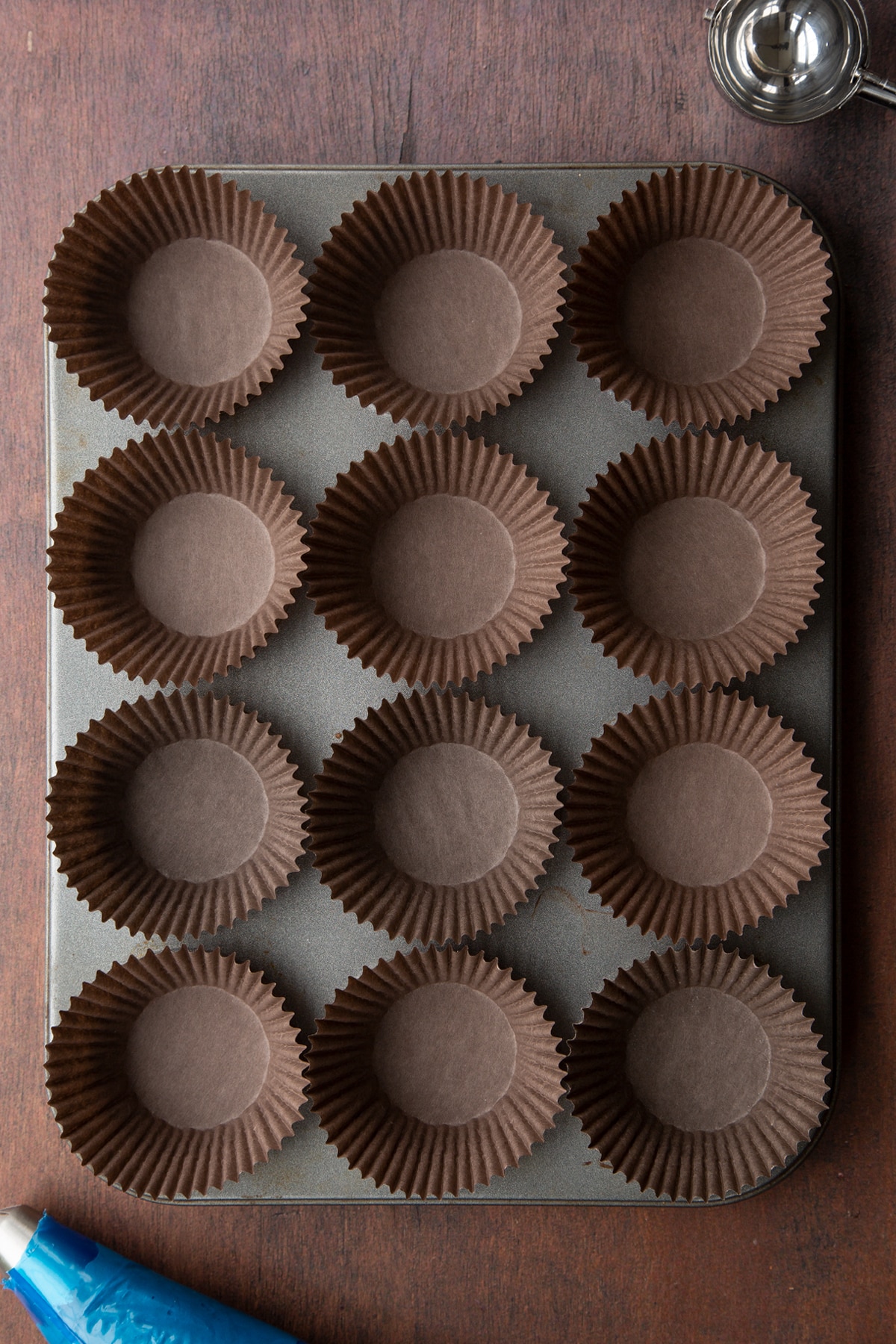 Cupcake cases in a 12 hole muffin tray.