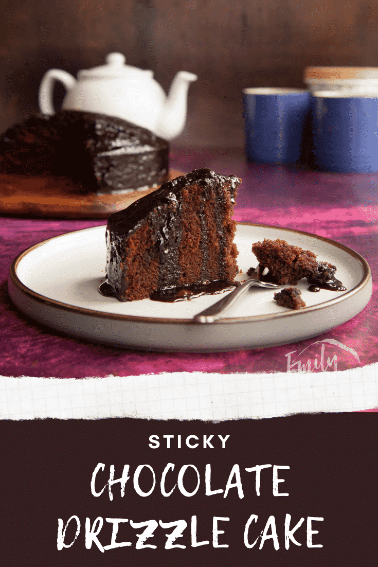 A slice of chocolate drizzle cake on a plate with a fork that has crumbs on it. Caption reads: Sticky chocolate drizzle cake.