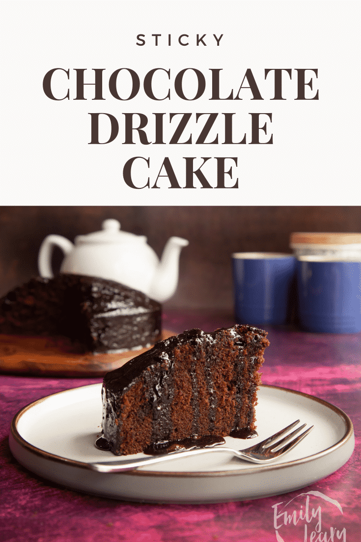 A slice of chocolate drizzle cake on a plate with a fork. Caption reads: Sticky chocolate drizzle cake.