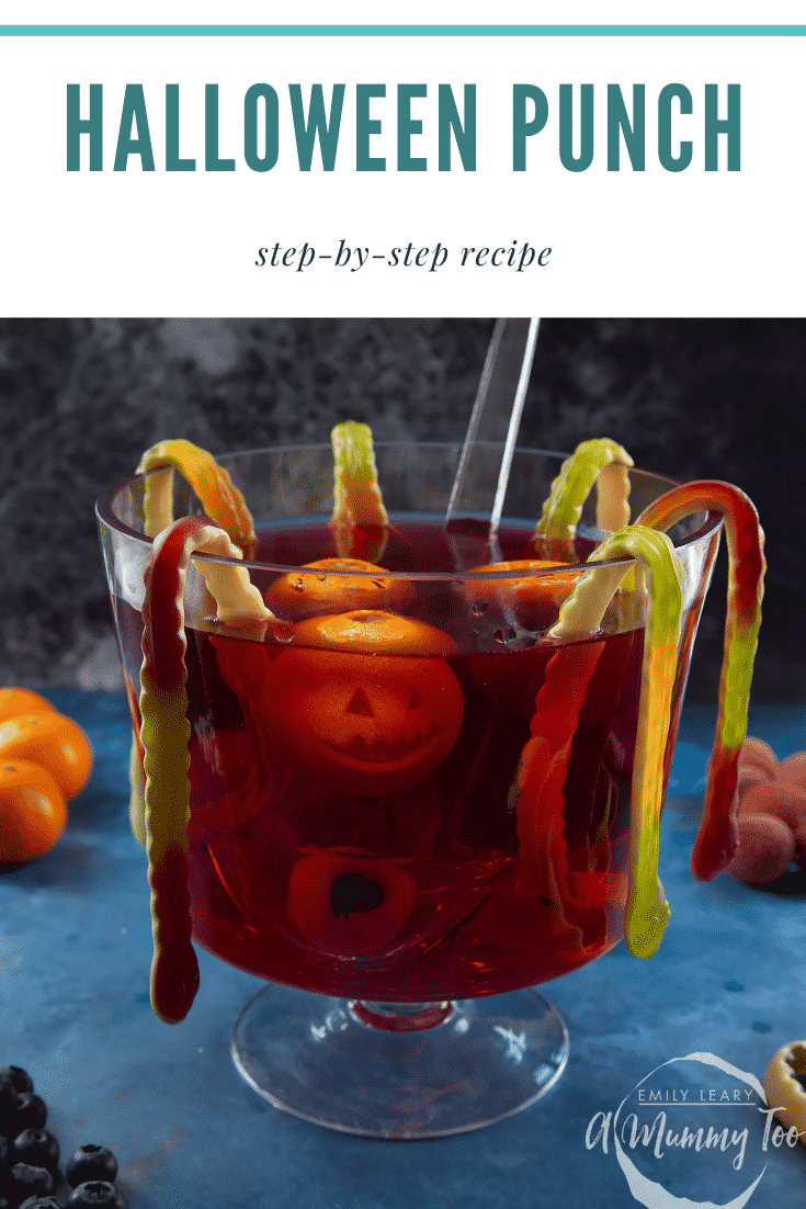 Halloween punch, decorated with fruit and gummy snakes. Caption reads: Halloween punch step-by-step recipe.