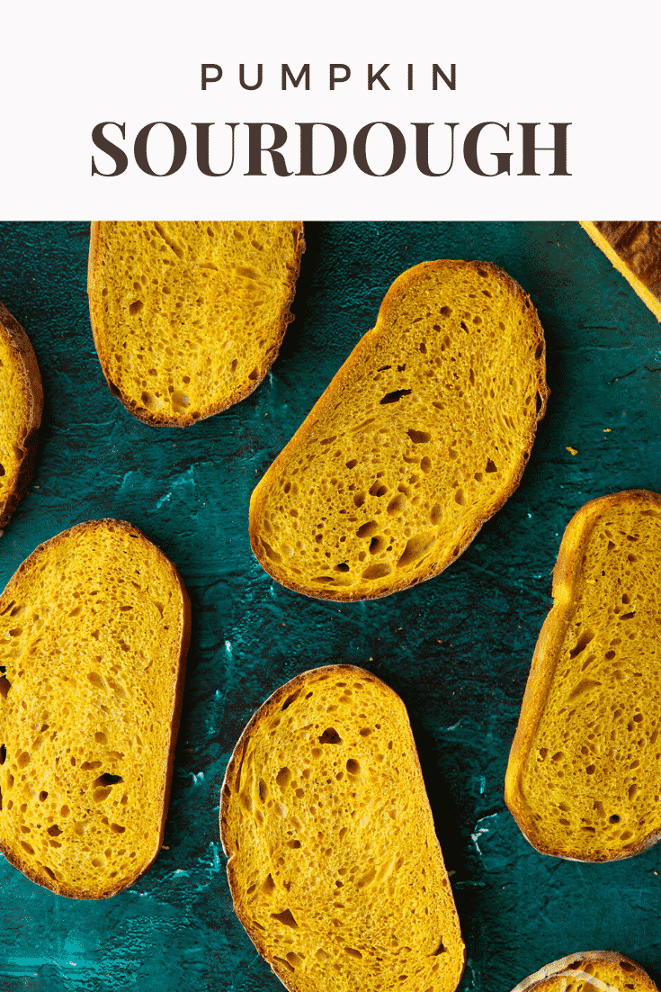 Pumpkin sourdough bread in slices. Caption reads: Pumpkin sourdough.