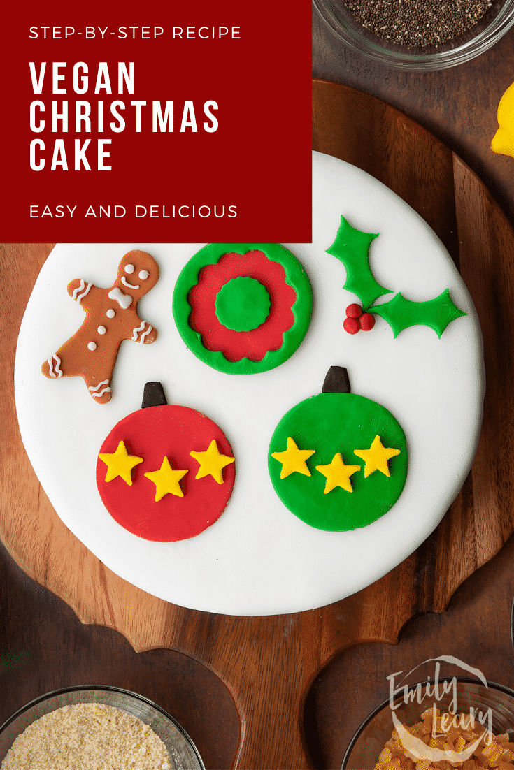 Vegan Christmas cake, decorated with sugar paste decorations. Caption reads: Step-by-step recipe. Vegan Christmas cake. Easy and delicious.