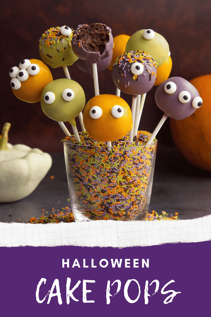 Halloween cake pops standing in a glass filled with Halloween sprinkles. One has been bitten. Caption reads: Halloween cake pops.