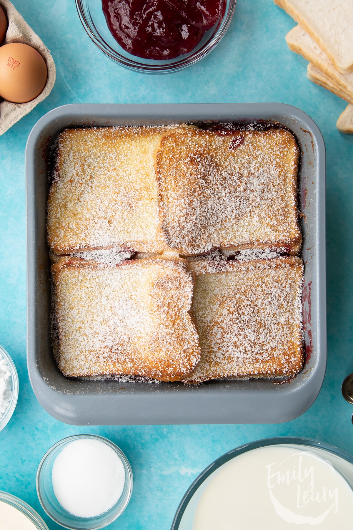 Overhead shot of the finished tin of Bread and butter pudding with jam.