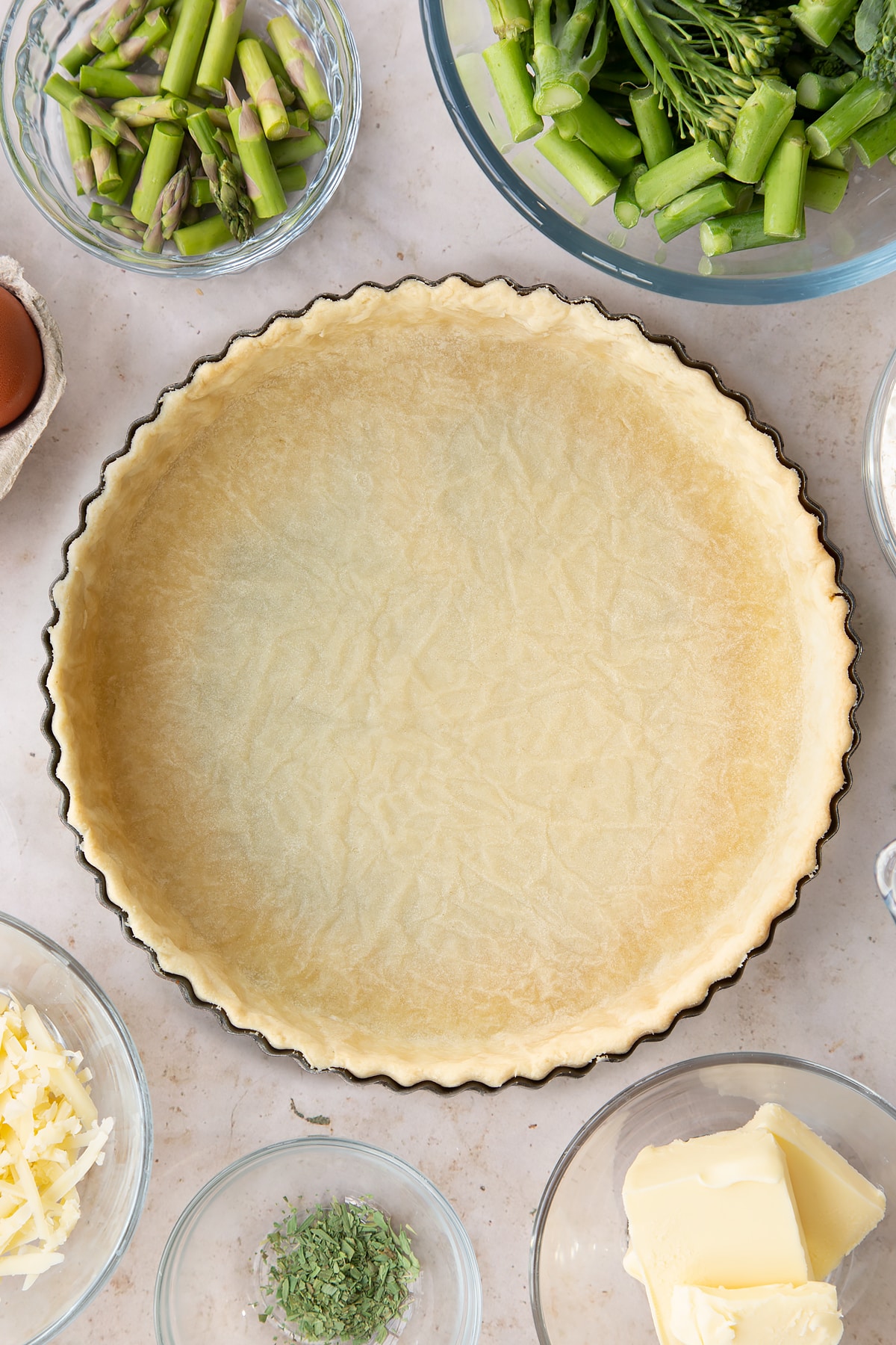 Overhead shot of the chestnut quiche pastry casing having been in the oven for 15 minutes.