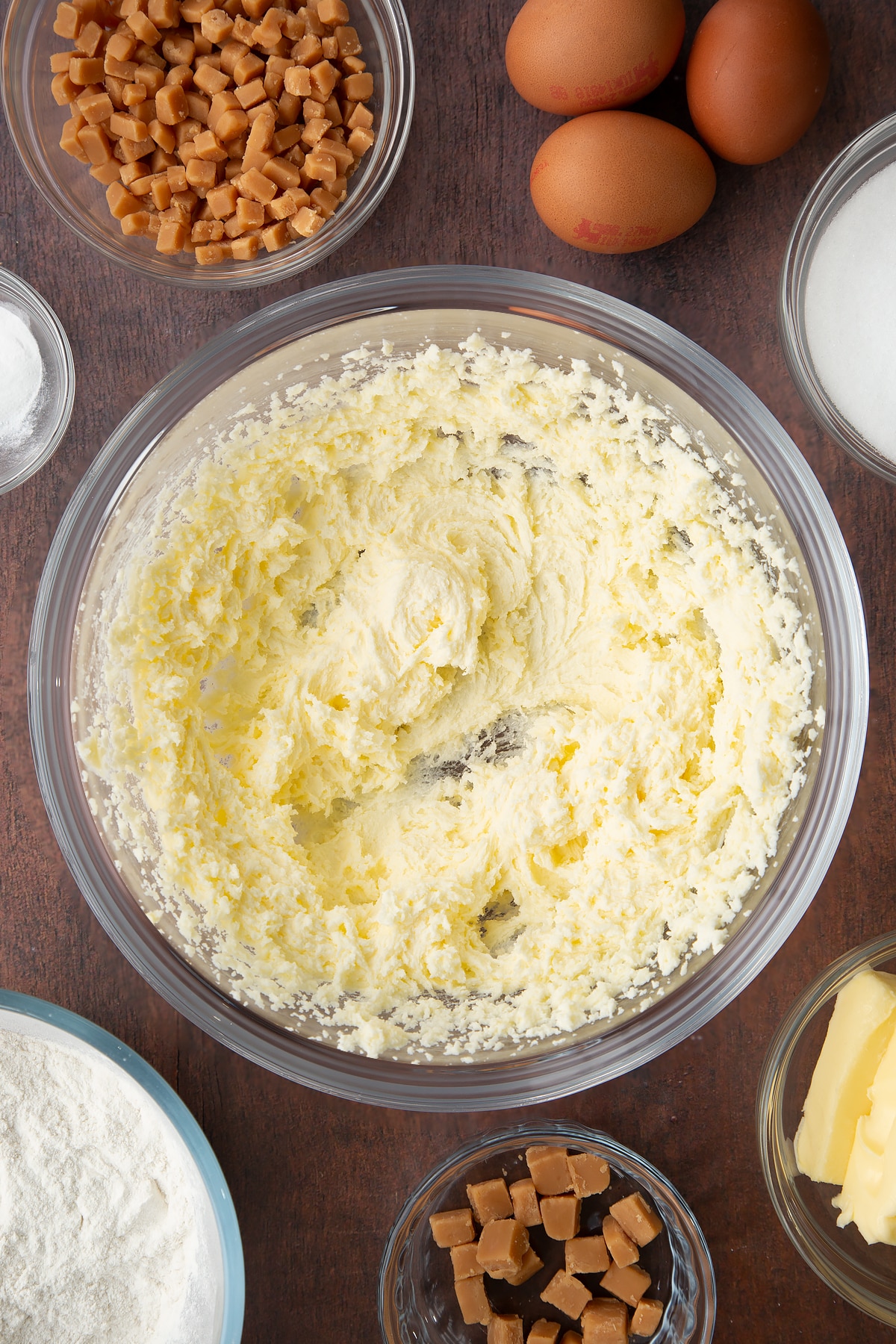 whisked butter and sugar in a large clear bowl.