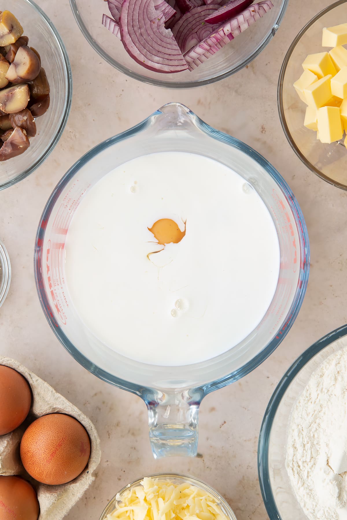 Overhead shot of milk and eggs in a jug.