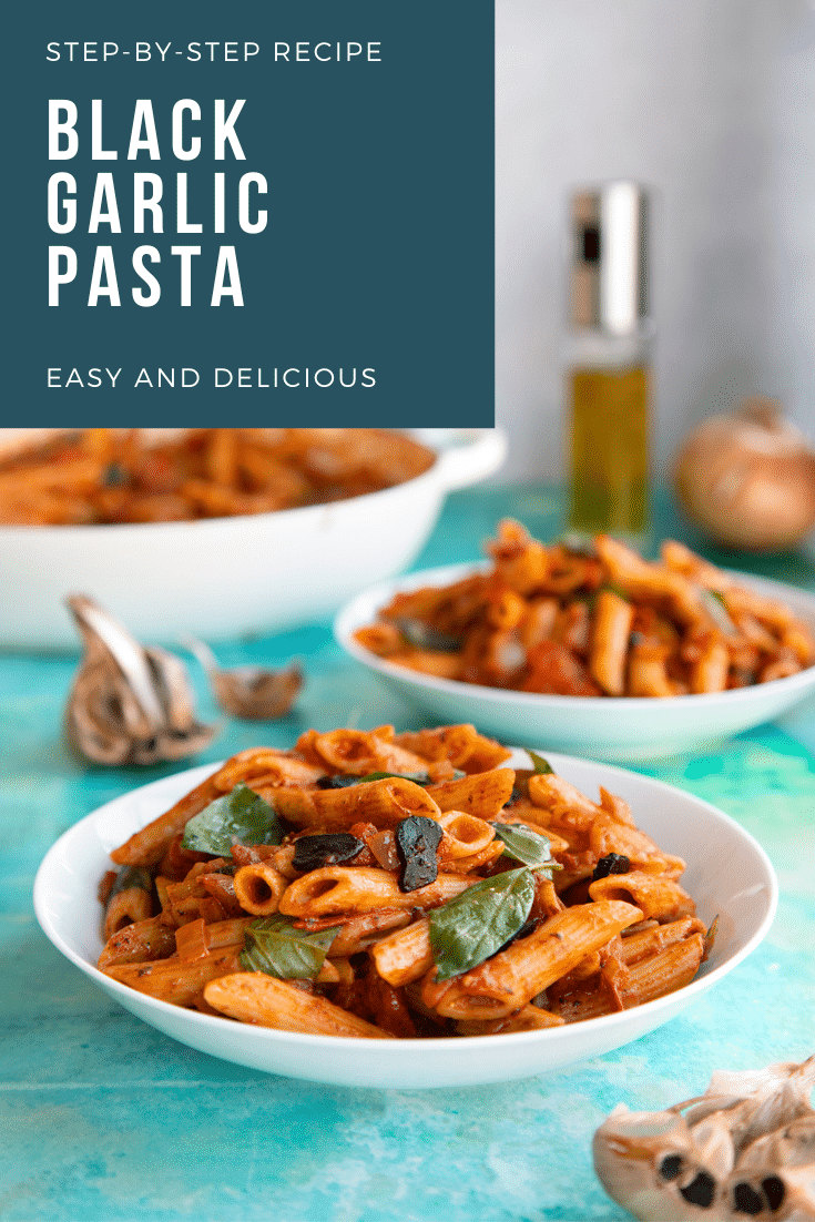 Side on shot of the black garlic pasta with text at the top of the image to describe it for Pinterest.
