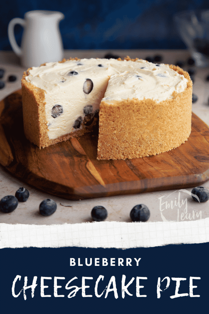 Blueberry cheesecake pie on a wooden board with a slice taken. Caption reads: Blueberry cheesecake pie.