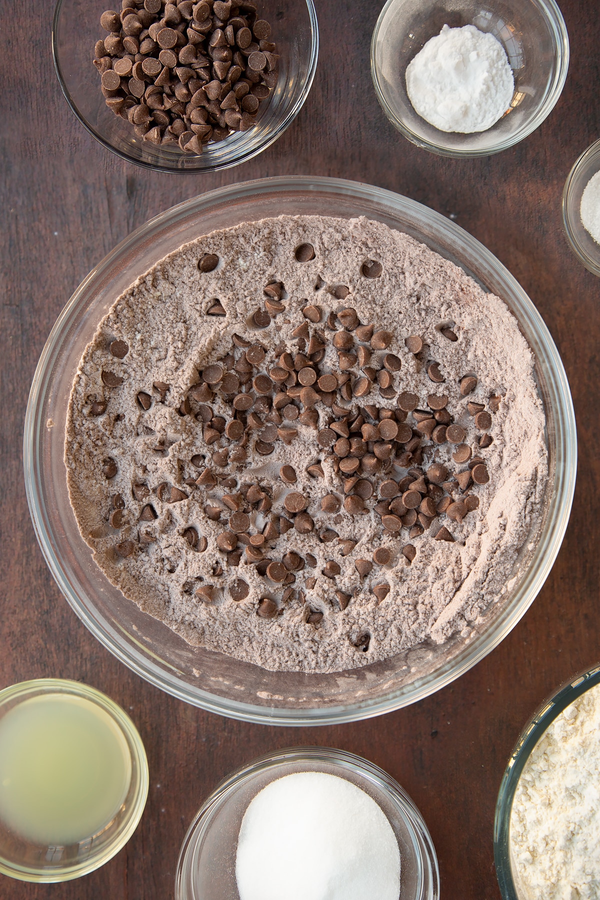 Overhead shot of the chocolate sprinkles being added to the chocolate soda bread mixture.