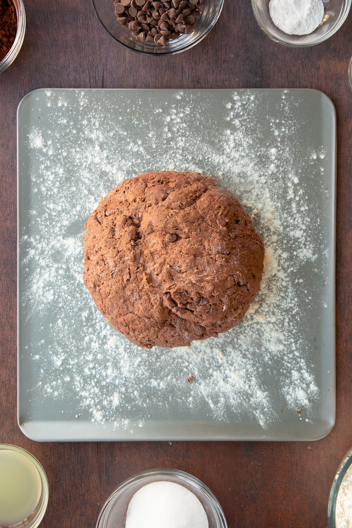 Overhead shot of the chocolate soda bread dough on a lightly floured baking sheet.
