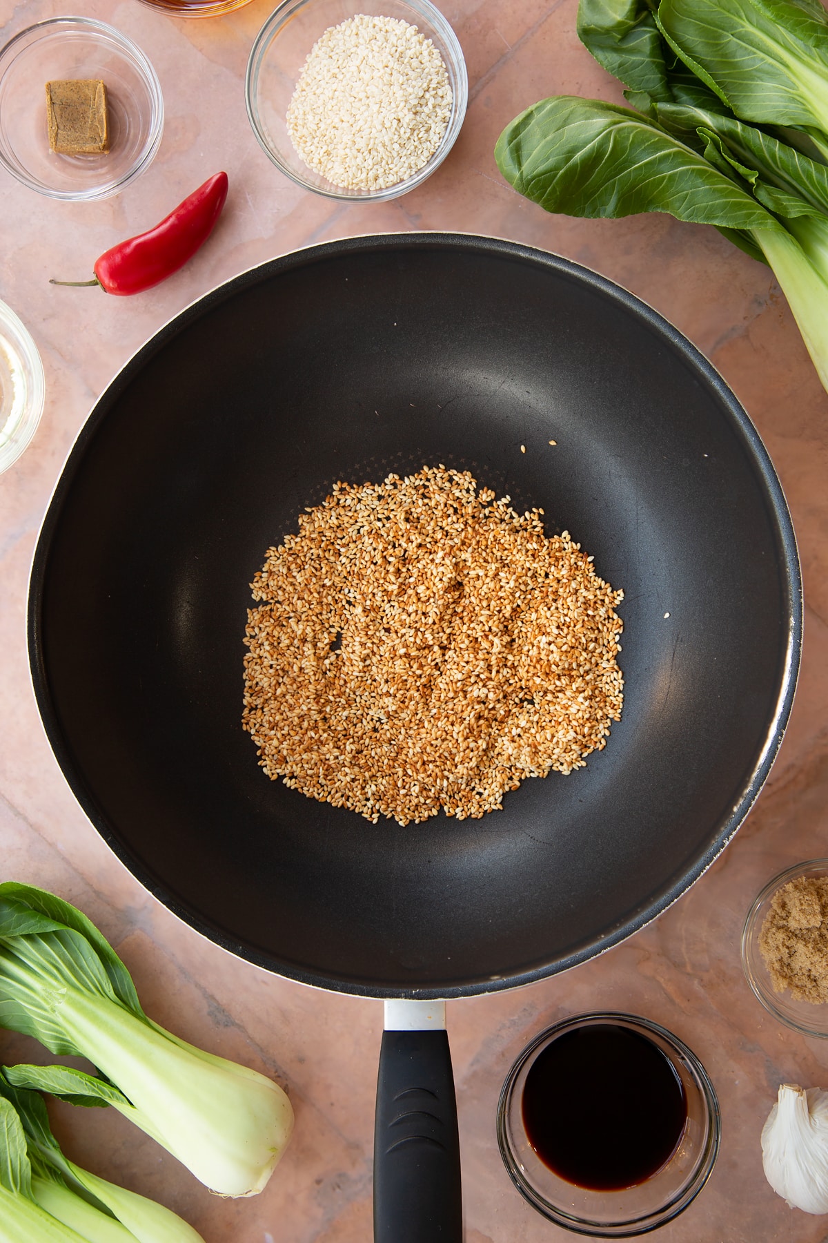 Overhead shot of the baked seasme seeds in a pan.