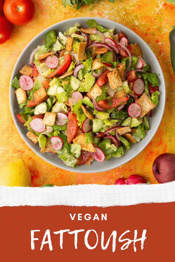 Vegan fattoush on a grey plate. Caption reads: Vegan fattoush.