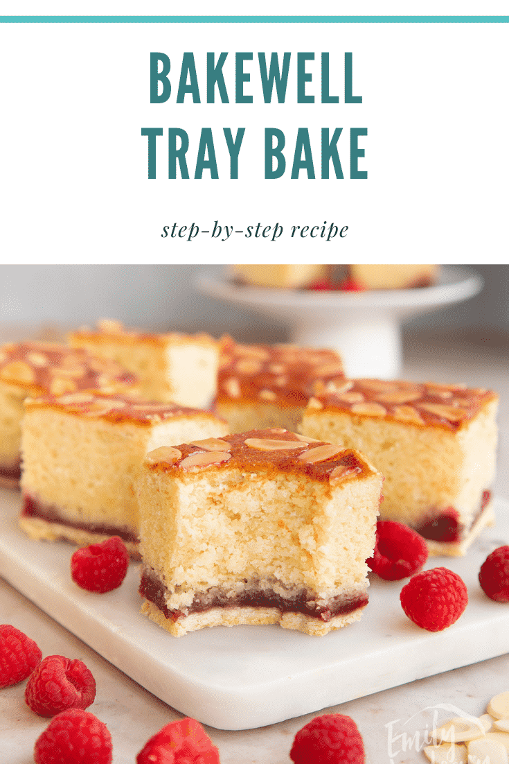 Squares of Bakewell tray bake on a white marble board. One has a bite out of it. Caption reads: Bakewell tray bake. Step-by-step recipe.
