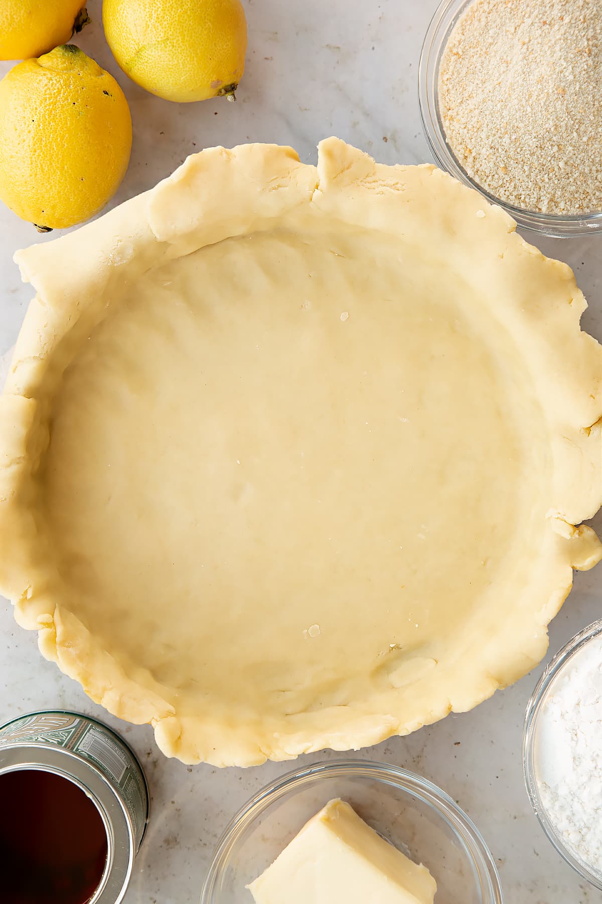 Overhead shot of the dough inside a pastry tin.