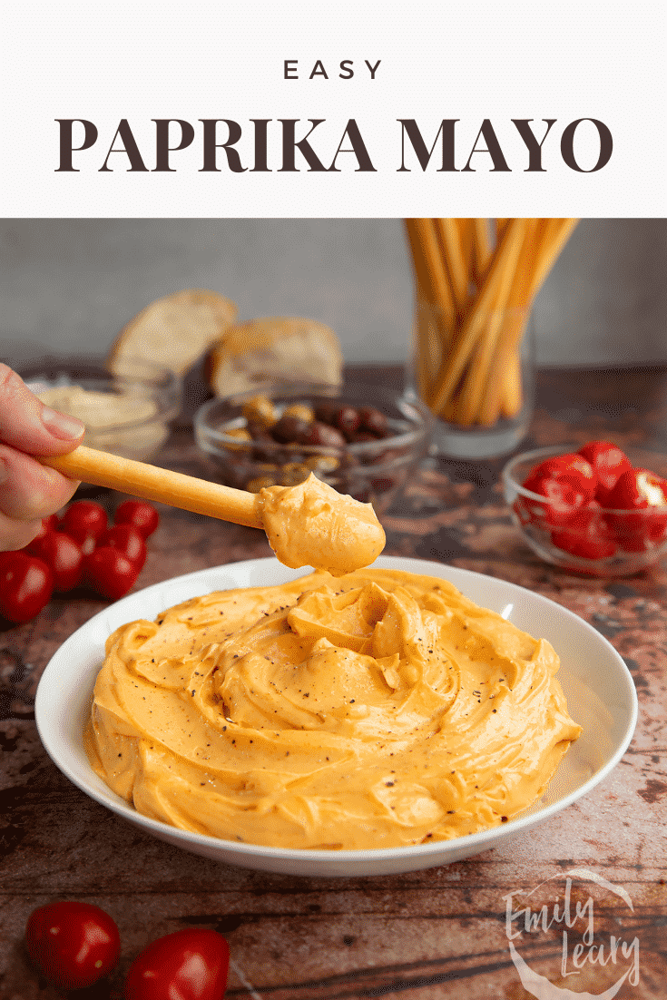 Paprika mayo in a shallow white bowl. A breadstick is being dipped in. Caption reads: Easy paprika mayo