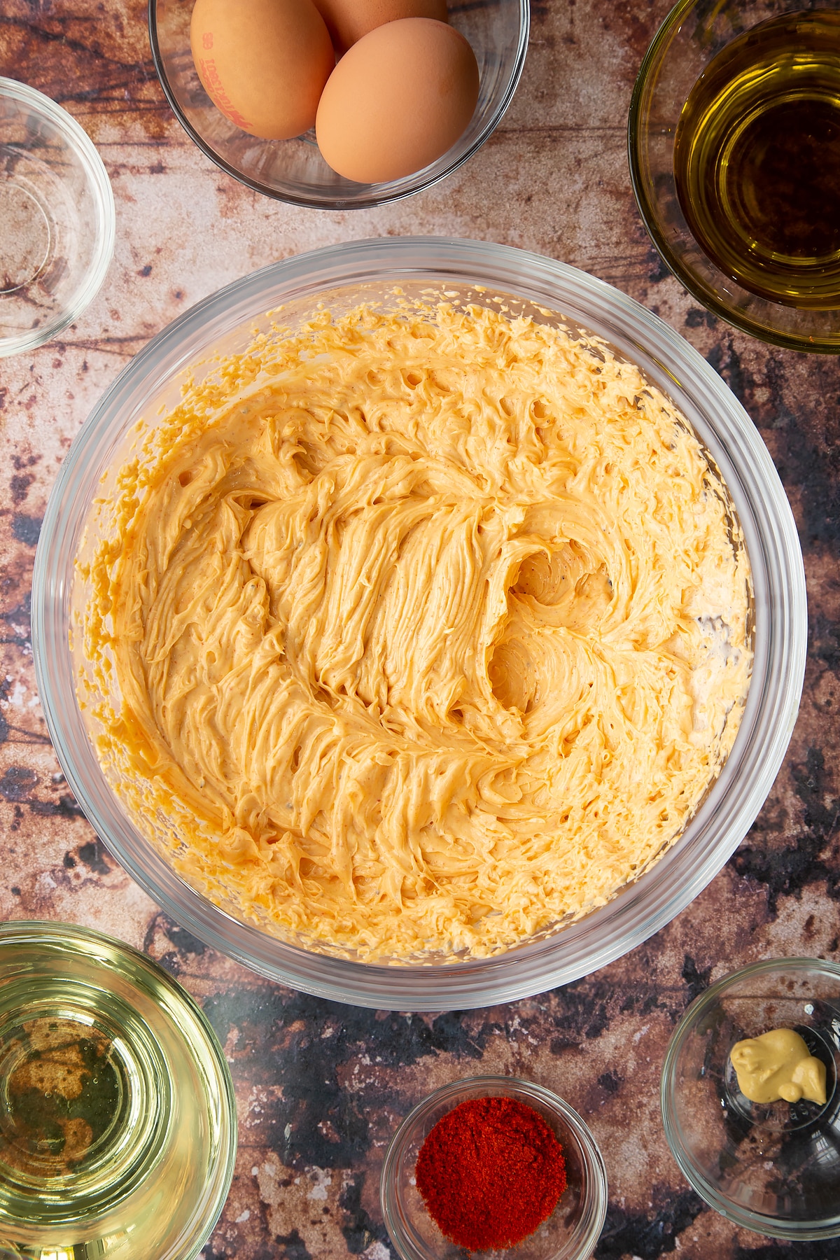 Paprika mayo in a glass mixing bowl.